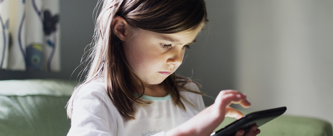 A photo of a child using a tablet.