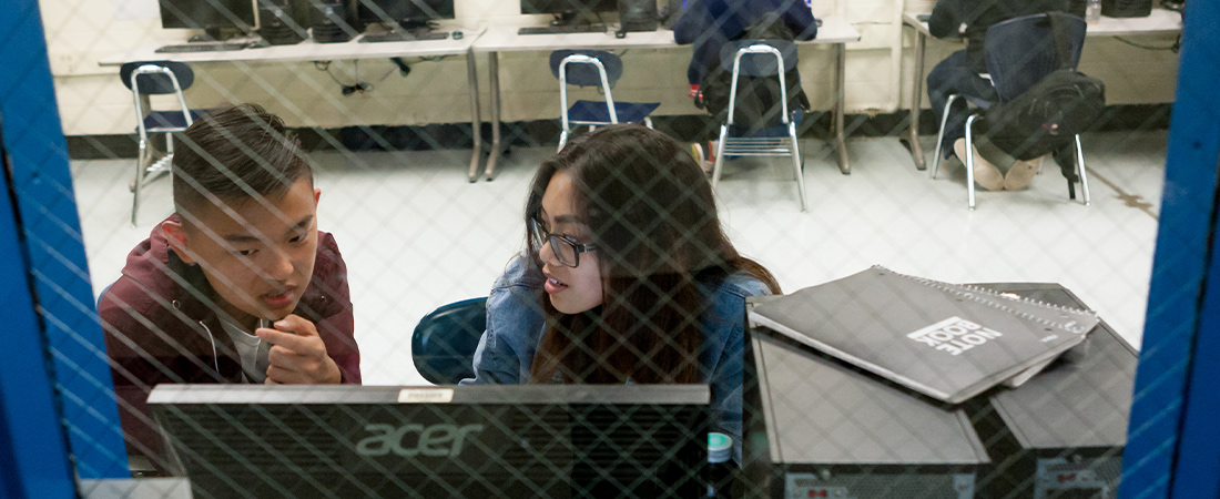 Photo of students using a computer
