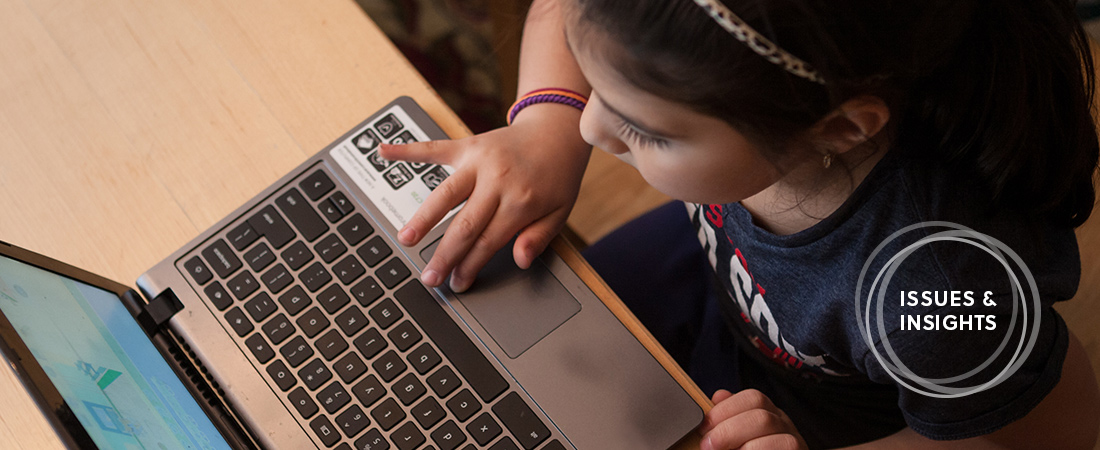 Photo of a child using a computer