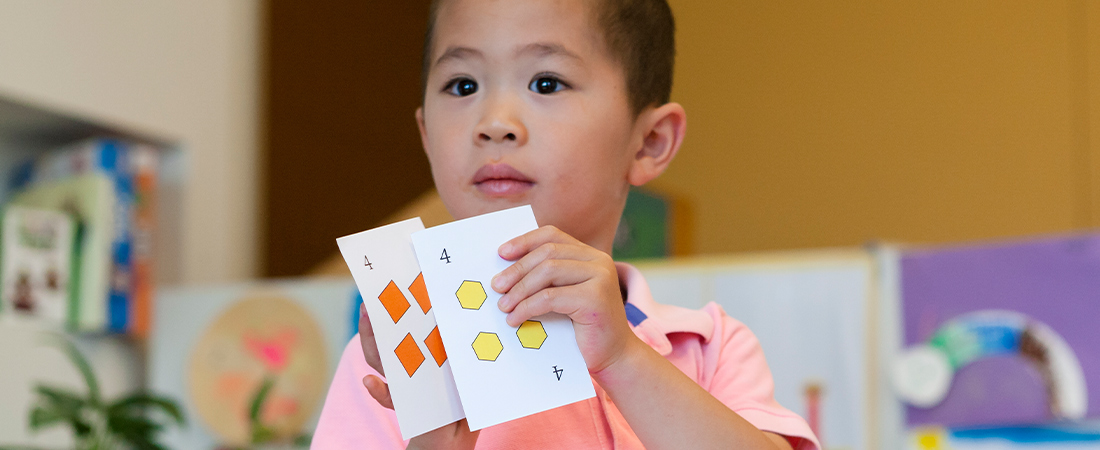 A child playing a math game representing 3 Ways to Promote Social and Emotional Learning through Math