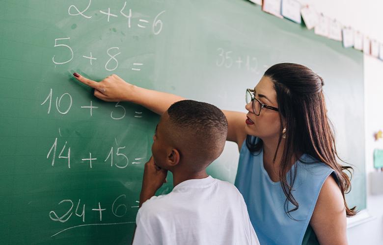 A photo of a student and teacher representing Out of the College Classroom and into the Community: Building Teachers’ Cultural Awareness and Competence 