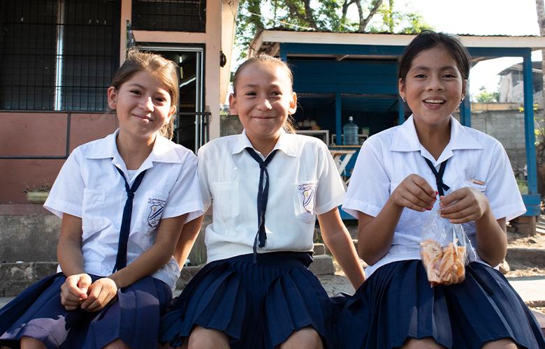 A photo of students representing Adolescent Girls Need More than Paper Dreams