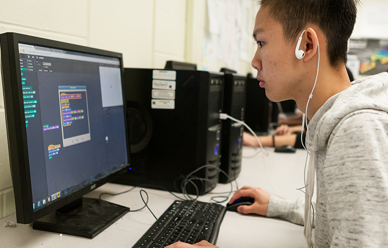 How Can We Support Computational Thinking in Schools? A photo of a student using a computer representing How Can We Support Computational Thinking in Schools?