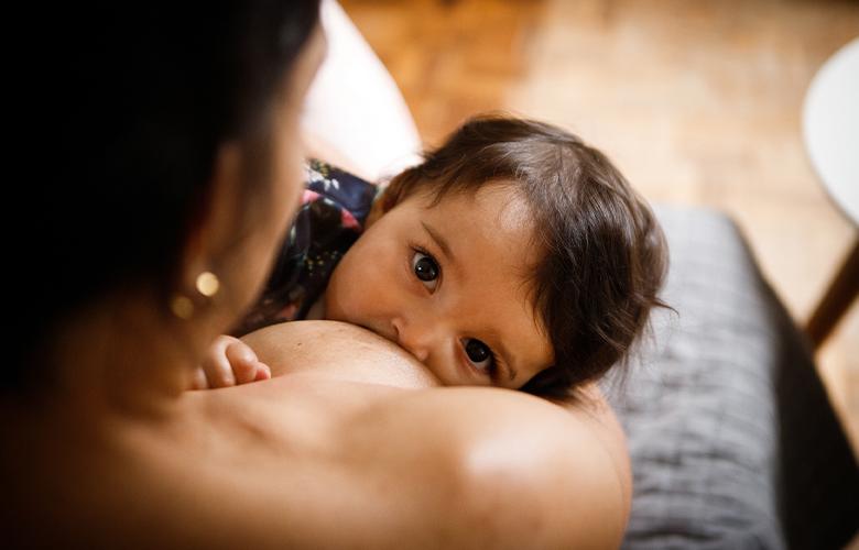 How Can We Improve Breastfeeding Rates? A photo of a child breastfeeding
