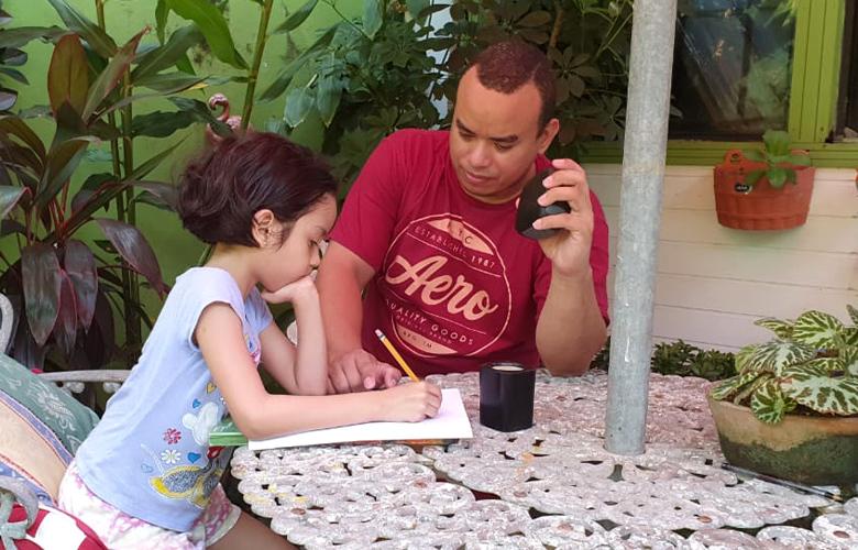 A photo of parent and child learning at home representing International Literacy Day—September 8