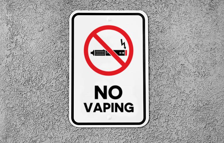 A photo no vaping sign to represent Reducing Teen Vaping: States and Communities Take the Lead