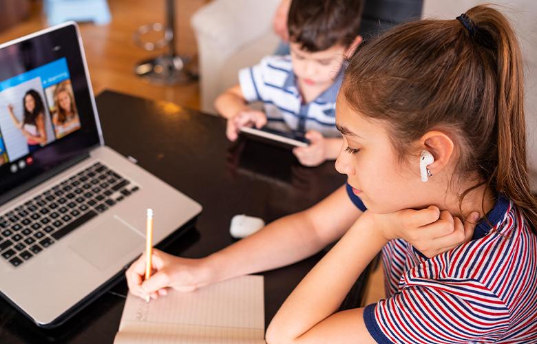 How Can Educators Address Student Trauma During COVID-19? A photo of students working from home
