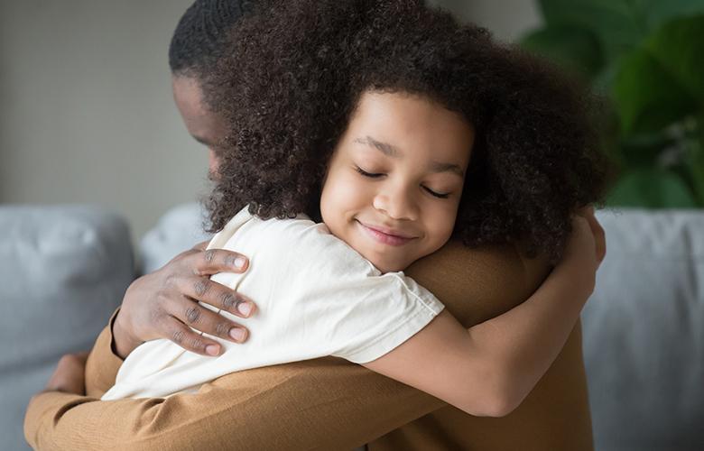Tips for Parents: Integrating SEL into Remote Learning A photo of parent and child representing Tips for Parents: Integrating SEL into Remote Learning