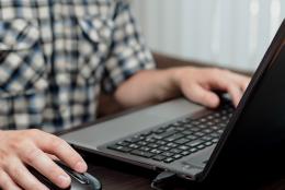 A picture of a person using a computer.