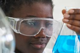 A photo of a student working in a lab representing Bringing Biotech Learning to East Boston High School Students