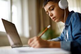 Digital Learning Day: Ways to Support Successful Online Learning Student using a computer representing Digital Learning Day: Ways to Support Successful Online Learning