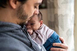 A photo of a father and child representing The Critical Role of Home Visiting in Recognizing and Addressing Paternal Depression