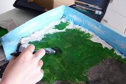 Engaging Students through Performance Assessment A photo of a person painting representing Engaging Students through Performance Assessment
