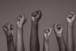 Lift Every Voice A photo of raised hands representing Lift Every Voice