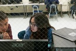 Photo of students using a computer