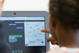 A photo of student using computer representing Could Learning to Program Help Young Children Learn Math?