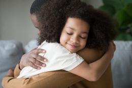 Tips for Parents: Integrating SEL into Remote Learning A photo of parent and child representing Tips for Parents: Integrating SEL into Remote Learning
