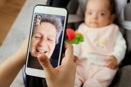 A photo of an older adult using facetime