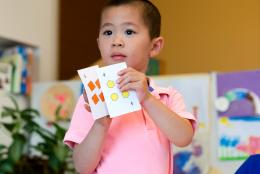 Learning Math with Your Preschoolers: Fun in the Talking and the Playing A photo of a young child doing math representing Learning Math with Your Preschoolers: Fun in the Talking and the Playing