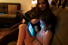 What the Tech?: Parenting, Young Children, and Digital Tools in the Age of COVID-19 A photo of parent and children using tablet