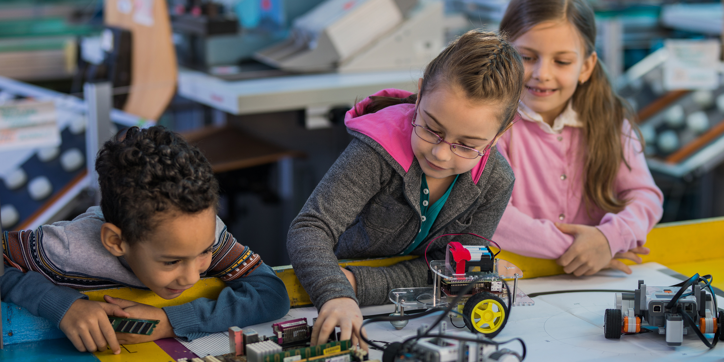 A photo of children engaged in STEM representing CADRE: 17 Years of Advancing STEM Education Innovation   