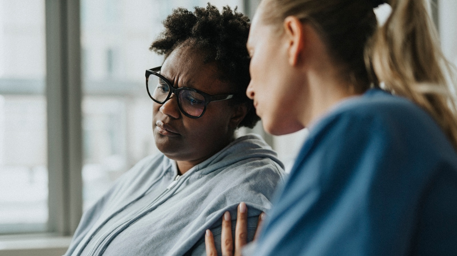 A photo of a nurse and patient representing 